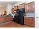 Kitchen showcasing beautiful cabinets, granite counters, and a black appliance package at 5131 Delphinium Cir, Brighton, CO 80601