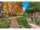 Landscaped community courtyard featuring mature trees, green space, and walkways at 2400 E Cherry Creek South Dr # 304, Denver, CO 80209