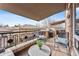 Picturesque patio area with elegant railings and retractable awning, creating an inviting space at 2400 E Cherry Creek South Dr # 304, Denver, CO 80209