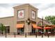 An exterior view of the Chop Shop Casual Urban Eatery in the Lowry Town Center at 6600 E 4Th Ave, Denver, CO 80220