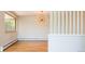 Open dining area with hardwood floors, natural light and contemporary chandelier at 6600 E 4Th Ave, Denver, CO 80220