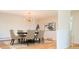 Dining room showcasing a modern chandelier, hardwood floors, and elegant decor at 6600 E 4Th Ave, Denver, CO 80220