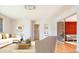 Bright living room featuring stylish decor, hardwood floors, and a comfortable seating area at 6600 E 4Th Ave, Denver, CO 80220