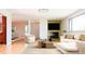 Staged living room with modern furniture and a fireplace, creating a cozy atmosphere at 6600 E 4Th Ave, Denver, CO 80220