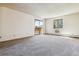Spacious bedroom with a balcony access and plenty of room for personalization at 7420 E Quincy Ave # 304, Denver, CO 80237