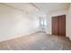 Unfurnished bedroom offering ample space, natural light, and a large closet at 7420 E Quincy Ave # 304, Denver, CO 80237