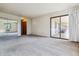 Expansive bedroom with sliding glass doors to the outside and a spacious closet at 7420 E Quincy Ave # 304, Denver, CO 80237