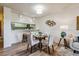 Open-concept dining room adjacent to the kitchen, featuring a table setting and decor at 7420 E Quincy Ave # 304, Denver, CO 80237