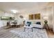 Open floor plan with a cozy living room and dining area, featuring modern decor at 7420 E Quincy Ave # 304, Denver, CO 80237