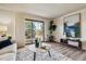 Comfortable living room with a balcony overlooking a scenic view and stylish decor at 7420 E Quincy Ave # 304, Denver, CO 80237