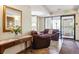 Lobby with comfortable seating, floral arrangement, and tiled floors at 7420 E Quincy Ave # 304, Denver, CO 80237
