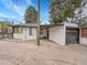 Rear view of a well-maintained home featuring a concrete driveway and garage at 755 S Milwaukee St, Denver, CO 80209