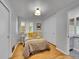 Bedroom features a neutral color palette, hardwood floors, ample natural light and a spacious closet at 755 S Milwaukee St, Denver, CO 80209