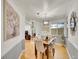 Stylish dining room with hardwood floors, modern decor, and natural light, ideal for intimate gatherings and memorable meals at 755 S Milwaukee St, Denver, CO 80209
