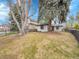 Well maintained home with grassy yard, large trees, and black metal fencing at 755 S Milwaukee St, Denver, CO 80209