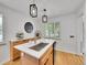 Kitchen boasts a large island, stainless steel appliances, quartz countertops, stylish pendant lights, and custom cabinets at 755 S Milwaukee St, Denver, CO 80209