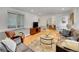 Cozy living room with hardwood floors, a comfortable sofa, and a view into the dining area, creating a warm, inviting atmosphere at 755 S Milwaukee St, Denver, CO 80209