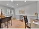 Office space with ample natural light, stone floors, neutral walls, and space for a table and chairs at 755 S Milwaukee St, Denver, CO 80209