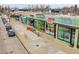 Aerial view of retail shops with vibrant storefronts and sidewalk parking at 755 S Milwaukee St, Denver, CO 80209