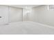 Clean, well-lit basement bedroom with neutral carpet, fresh paint, and a minimalist aesthetic at 2910 Clermont St, Denver, CO 80207