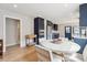 Updated kitchen with stainless steel appliances, a breakfast table, and a door to the exterior at 2910 Clermont St, Denver, CO 80207