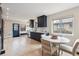 Bright, modern kitchen featuring sleek navy cabinets and a cozy dining area at 2910 Clermont St, Denver, CO 80207
