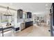 Open kitchen features a large breakfast nook and views into the living room at 2910 Clermont St, Denver, CO 80207