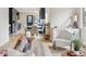 Open living space seamlessly blending living and dining areas with hardwood floors at 2910 Clermont St, Denver, CO 80207