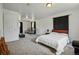 Spacious bedroom with carpet flooring, natural light, neutral tones, and closet access at 11715 W 30Th Pl, Lakewood, CO 80215