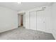 Bedroom featuring large closets and neutral color carpet at 11715 W 30Th Pl, Lakewood, CO 80215
