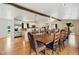 Open-concept design featuring a spacious dining area connected to the kitchen with hardwood flooring at 11715 W 30Th Pl, Lakewood, CO 80215