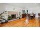 Living room with hardwood floors, brick fireplace, and plenty of space for decor and entertaining at 11715 W 30Th Pl, Lakewood, CO 80215
