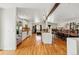 Open floor plan with hardwood floors, modern kitchen, dining area, and comfortable living space at 11715 W 30Th Pl, Lakewood, CO 80215