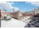 Beautifully landscaped backyard with patio, garden beds, and privacy fence at 1462 Eudora St, Denver, CO 80220