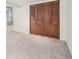 Bedroom with closet, neutral paint, new carpet, and good lighting at 1462 Eudora St, Denver, CO 80220
