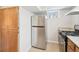 Charming kitchen featuring stainless steel appliances and wood cabinets at 1462 Eudora St, Denver, CO 80220