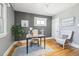 Office space featuring a grey wall color, light hued hardwood floor and great natural light at 1462 Eudora St, Denver, CO 80220