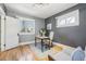 Office space featuring a grey wall color, light hued hardwood floor and great natural light at 1462 Eudora St, Denver, CO 80220
