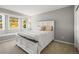 Comfortable bedroom featuring a large bed, bay window seating and neutral color scheme at 4204 Morning Star Dr, Castle Rock, CO 80108