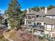 An elevated view showcasing the home's multiple decks and outdoor living spaces with hot tub and seating areas at 4204 Morning Star Dr, Castle Rock, CO 80108