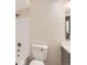 Cozy bathroom featuring a shower and tub combo with an attached washer and dryer at 909 S Dawson Way # 2, Aurora, CO 80012
