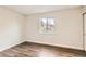 Bright bedroom showcasing wood-look flooring and a large window with pleasant natural light at 909 S Dawson Way # 2, Aurora, CO 80012