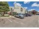 Condo building with well-maintained landscaping, painted wooden staircases and on-site parking at 909 S Dawson Way # 2, Aurora, CO 80012
