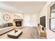 Inviting living room with stone fireplace, neutral color palette and plank flooring at 909 S Dawson Way # 2, Aurora, CO 80012