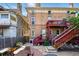 Multi-story brick home with fenced-in backyard featuring brick and stone patios at 1438 N Franklin St # 100, Denver, CO 80218