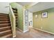 Basement hallway featuring stairs, neutral paint, and access to bedroom at 1438 N Franklin St # 100, Denver, CO 80218