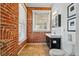 Bathroom boasts exposed brick and modern fixtures at 1438 N Franklin St # 100, Denver, CO 80218