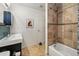 Modern bathroom featuring a tiled shower/tub combination and a sleek vanity at 1438 N Franklin St # 100, Denver, CO 80218