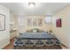 Bright bedroom with natural light, decorative artwork, and stylish furnishings at 1438 N Franklin St # 100, Denver, CO 80218