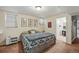 Comfortable bedroom with decorative art leads to an adjoining bathroom at 1438 N Franklin St # 100, Denver, CO 80218